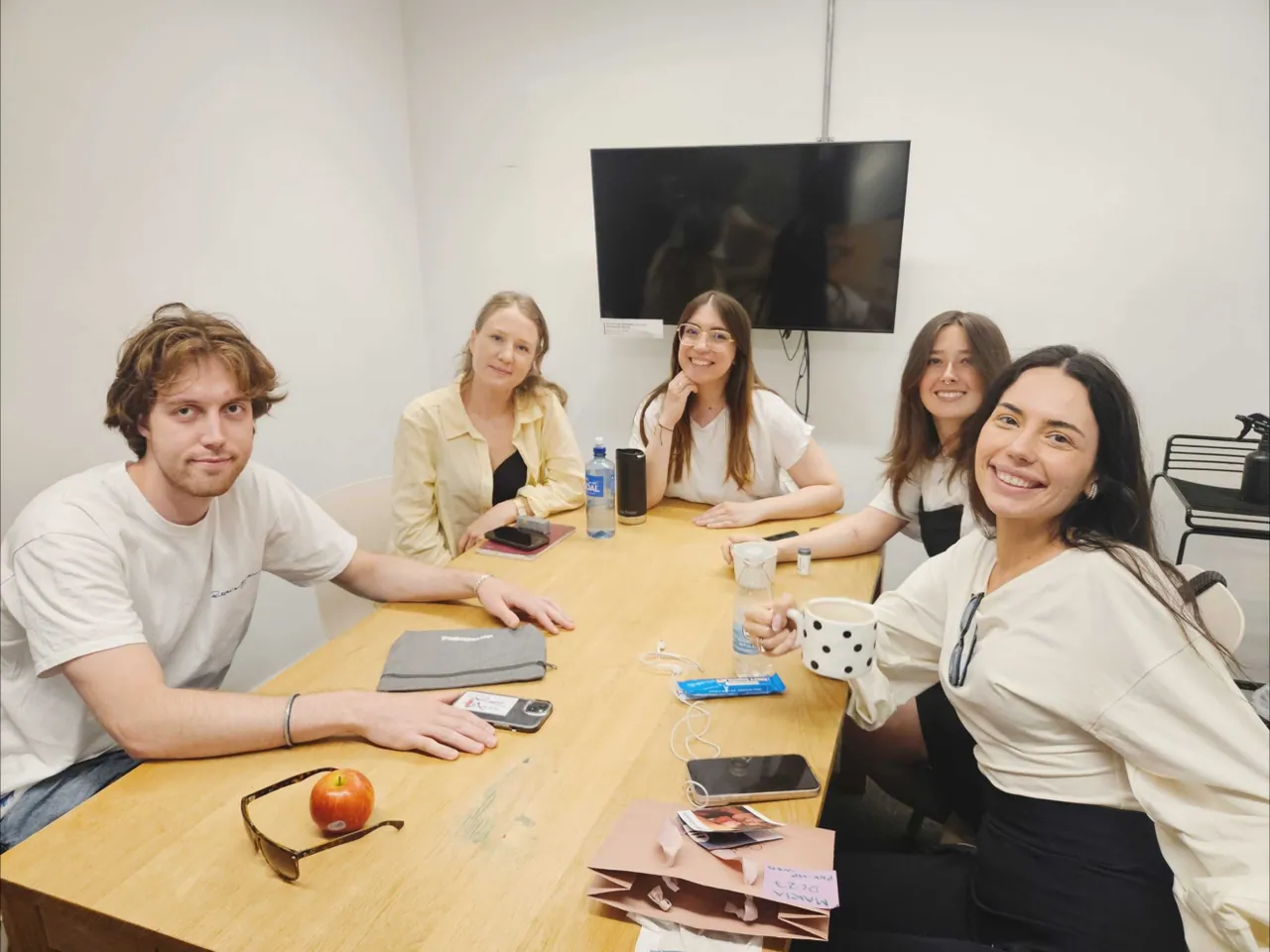 Action Society project team around a meeting table