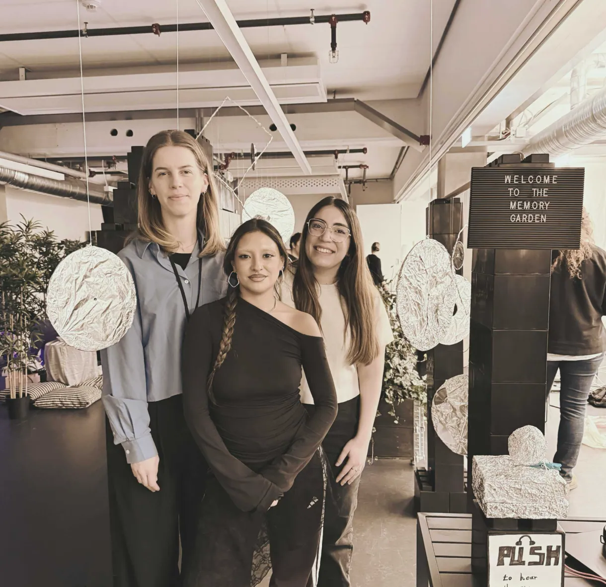The exhibition team standing among the Memory Garden installation